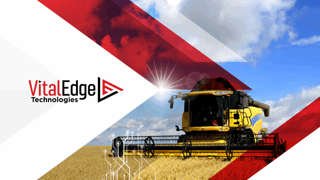 Yellow harvester in a field under blue sky