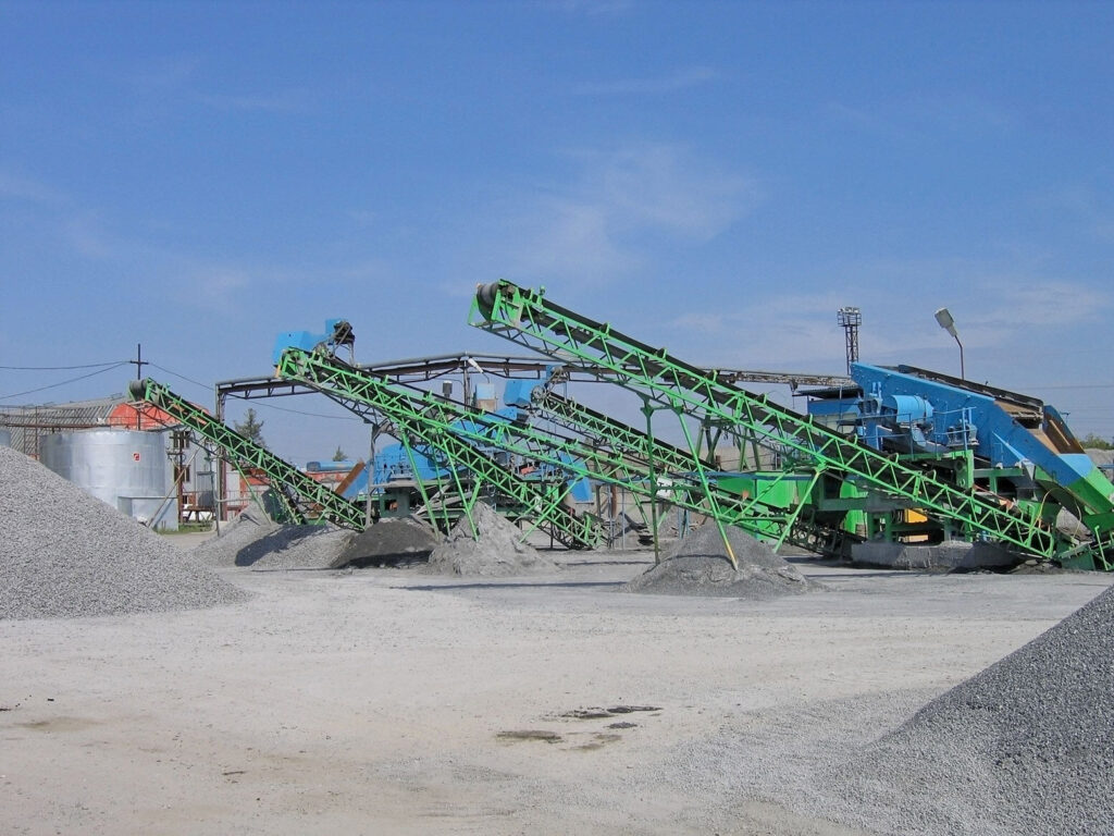 Industrial machinery processing gravel and stones.