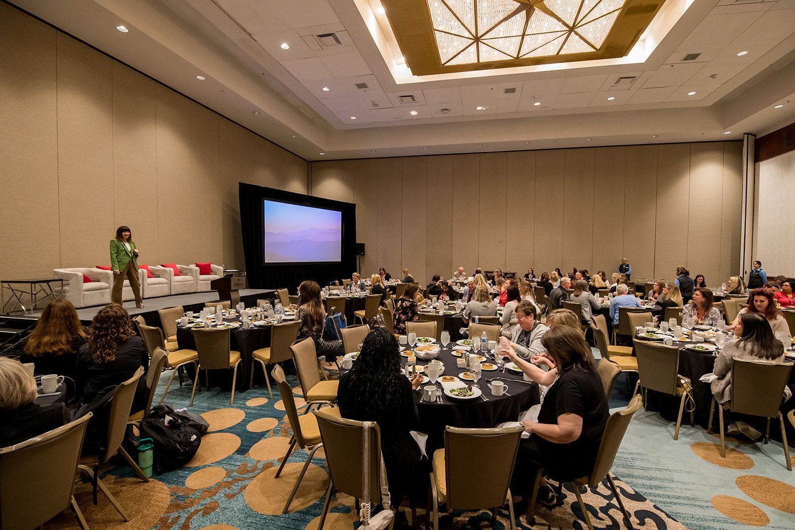 Conference attendees enjoying a keynote presentation.
