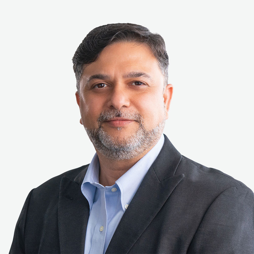 Professional man in a black jacket and blue shirt.