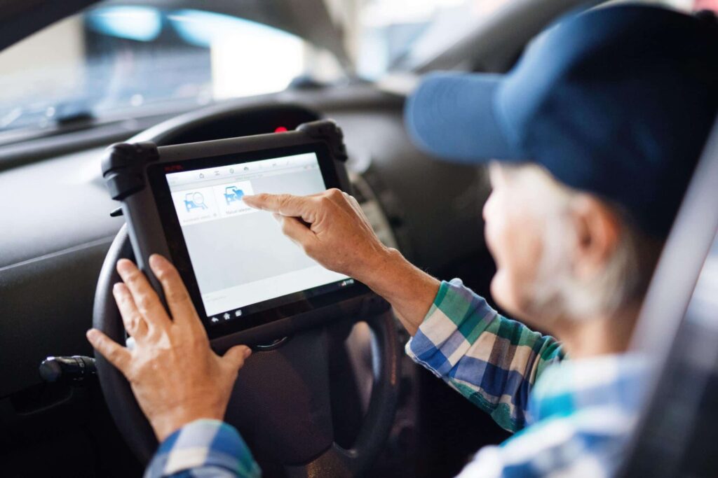Person using a tablet in a car