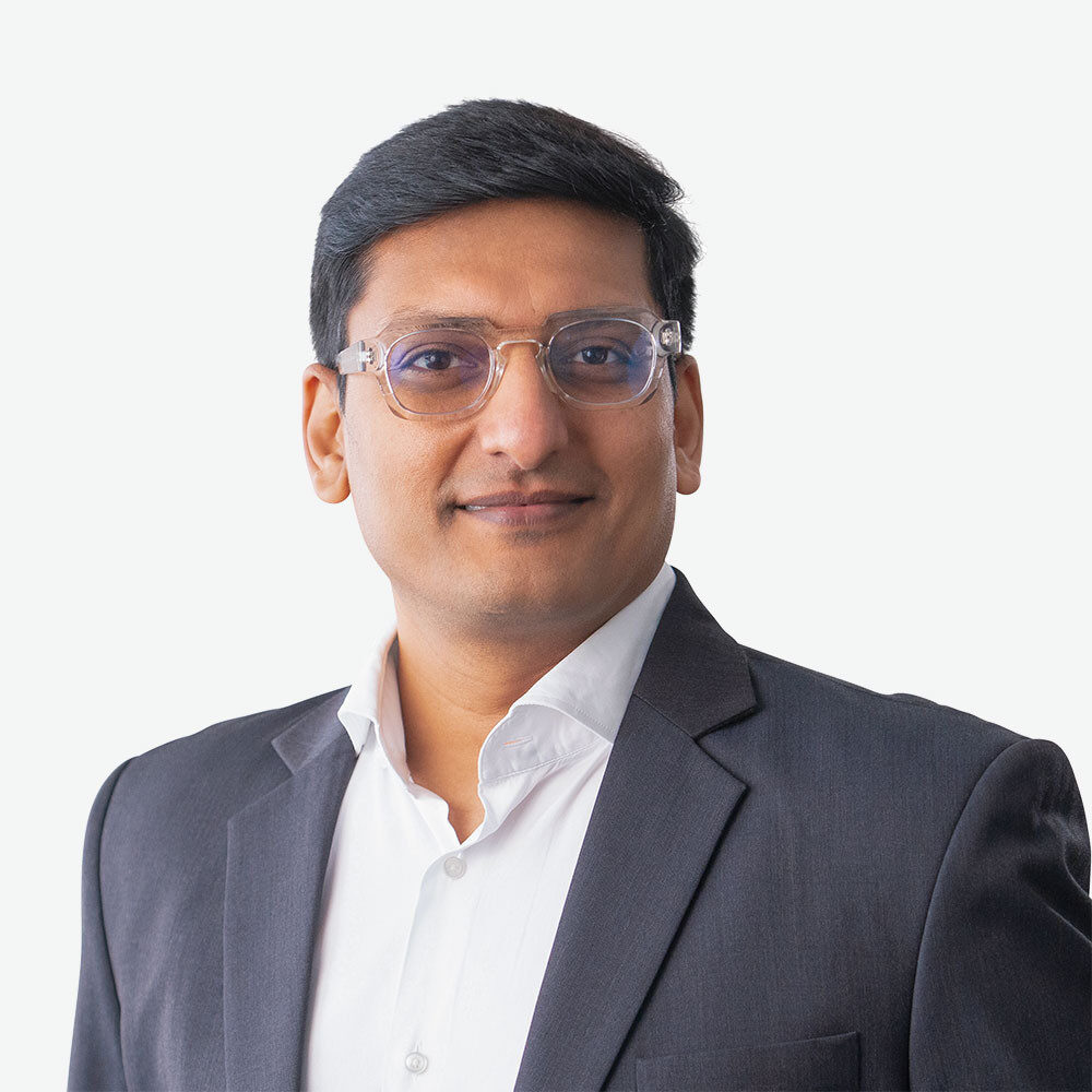 Professional man in suit with glasses.