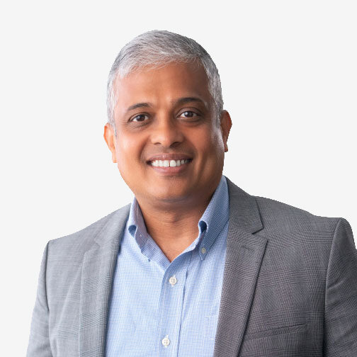 Smiling man in a gray suit jacket